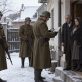 Илустрација: историјска реконструкција провере докумената пред породичном кућом током рације